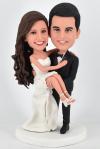 Customized bobbleheads cake toppers groom holding bride