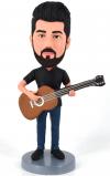 Custom bobbleheads playing guitar in my own outfits