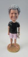 Custom bobbleheads bare foot on beach with crocs in hand