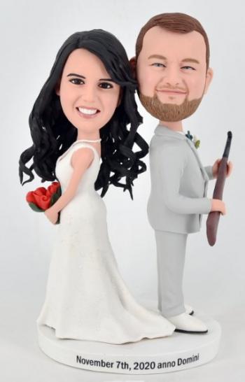 Custom Bobbleheads cake topper Smith couple groom holding gun