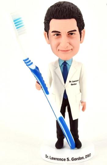 Custom bobblehead dentist holding toothbrush (random color)